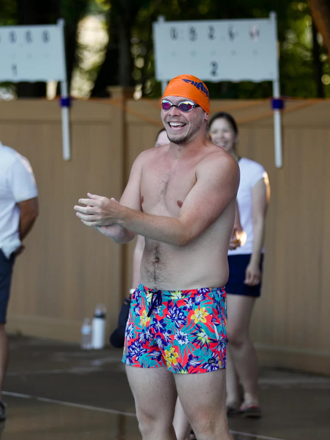 Coach celebrating poolside