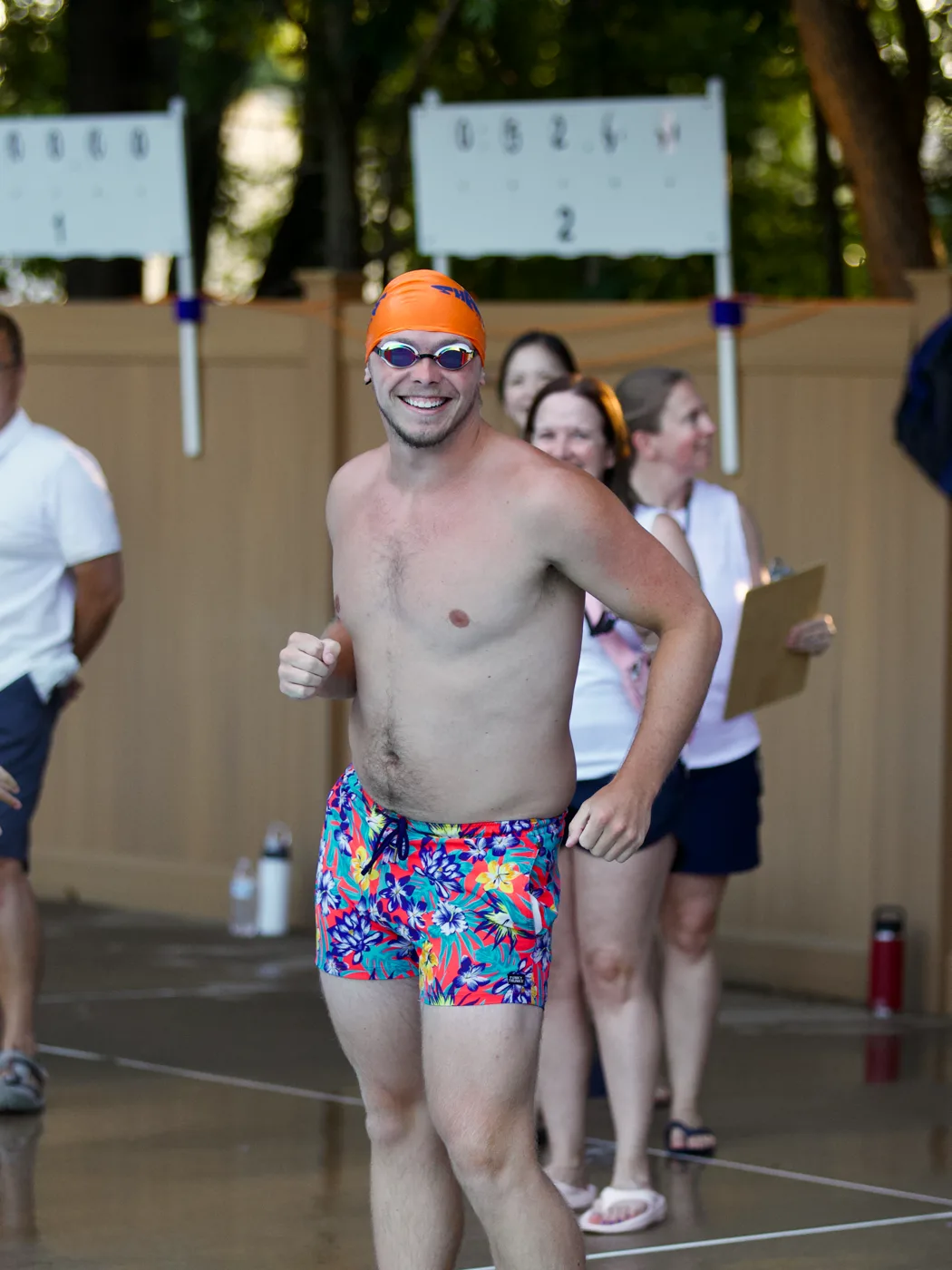 Coach celebrating poolside