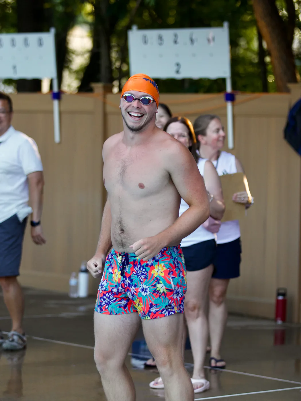 Coach celebrating poolside